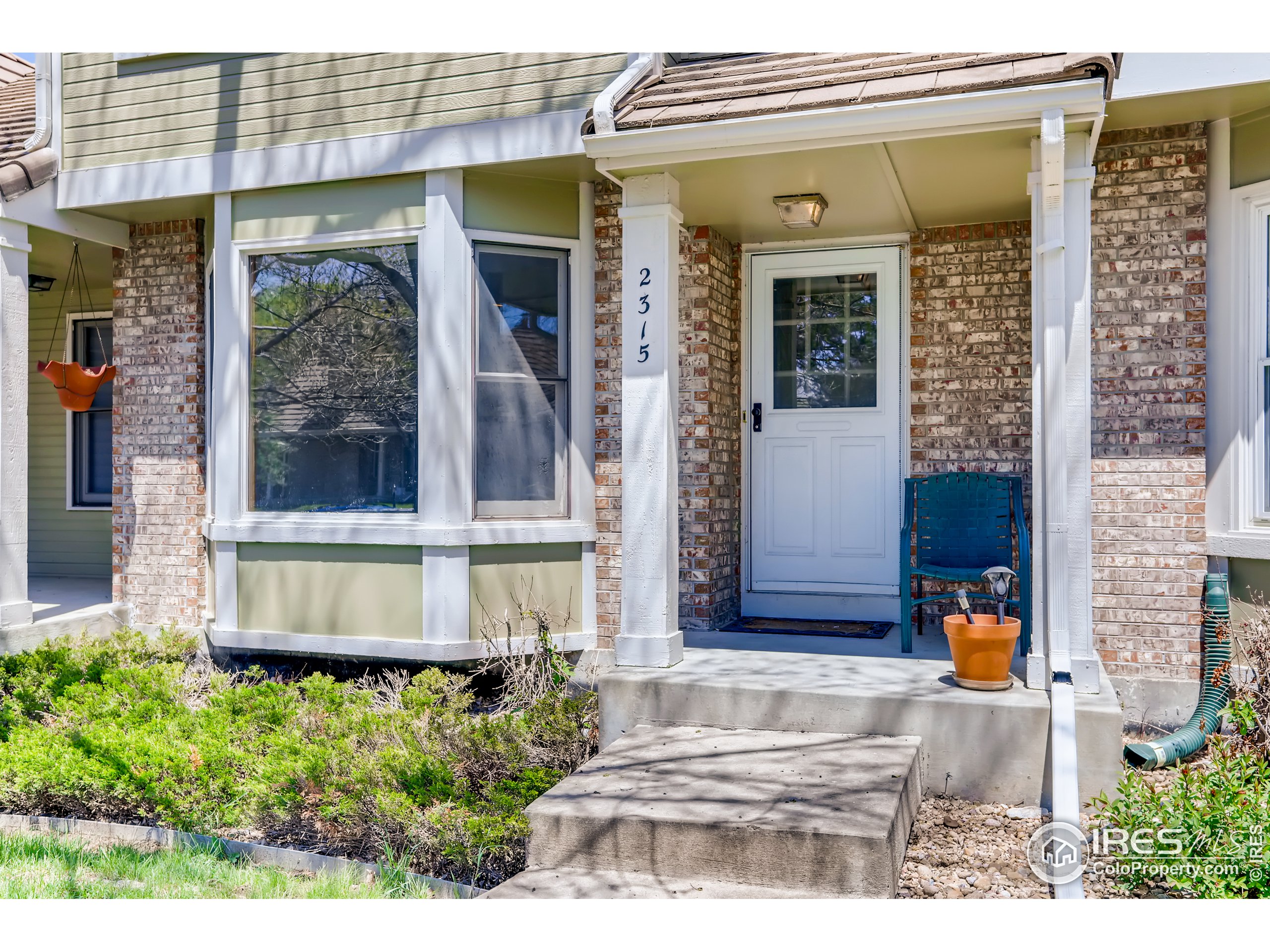 2315 Ranch Drive Westminster, CO 80234 - Photo 28 of 28 a front view of a house with a yard