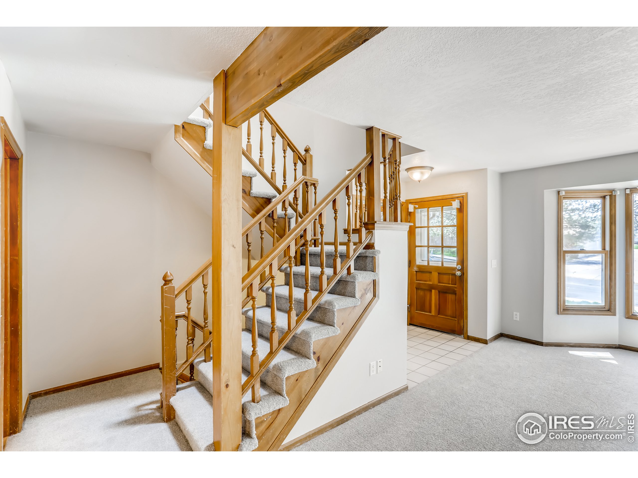 2315 Ranch Drive Westminster, CO 80234 - Photo 9 of 28 a view of entryway and hall with wooden floor