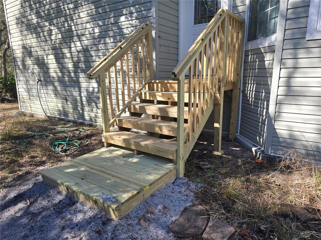 3690 Southeast 54th Avenue Morriston, FL 32668 - Photo 23 of 43 a view of outdoor space deck and yard