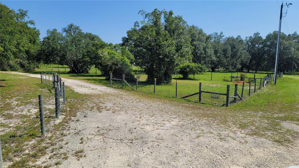 3690 Southeast 54th Avenue Morriston, FL 32668 - Photo 8 of 43 a view of a park with swings