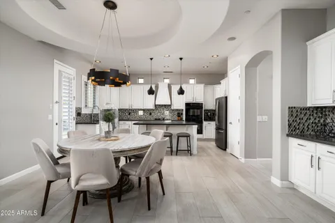 a living room with furniture and white walls