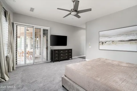 a living room with fireplace furniture and a flat screen tv