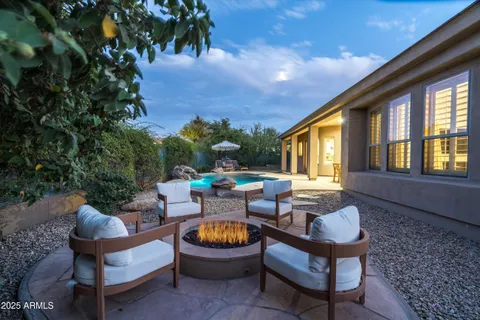 a view of a swimming pool with a lounge chair