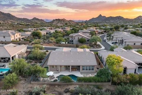 an aerial view of residential houses with outdoor space and street view