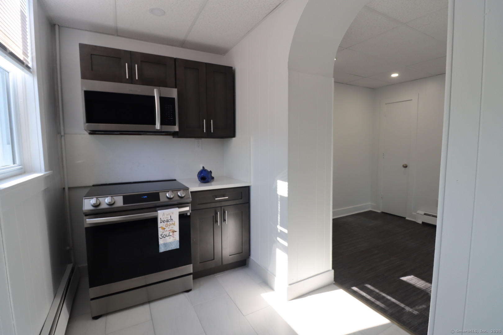 156 Garfield Avenue, Unit 11 New London, CT 06320 - Photo 1 of 1 a kitchen with a stove and a microwave