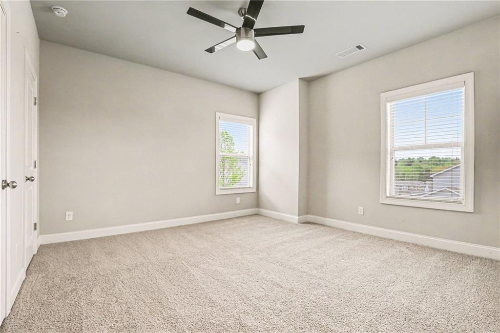 2960 Hampton Grv Trace Dacula, GA 30019 - Photo 17 of 33 a view of an empty room with a window