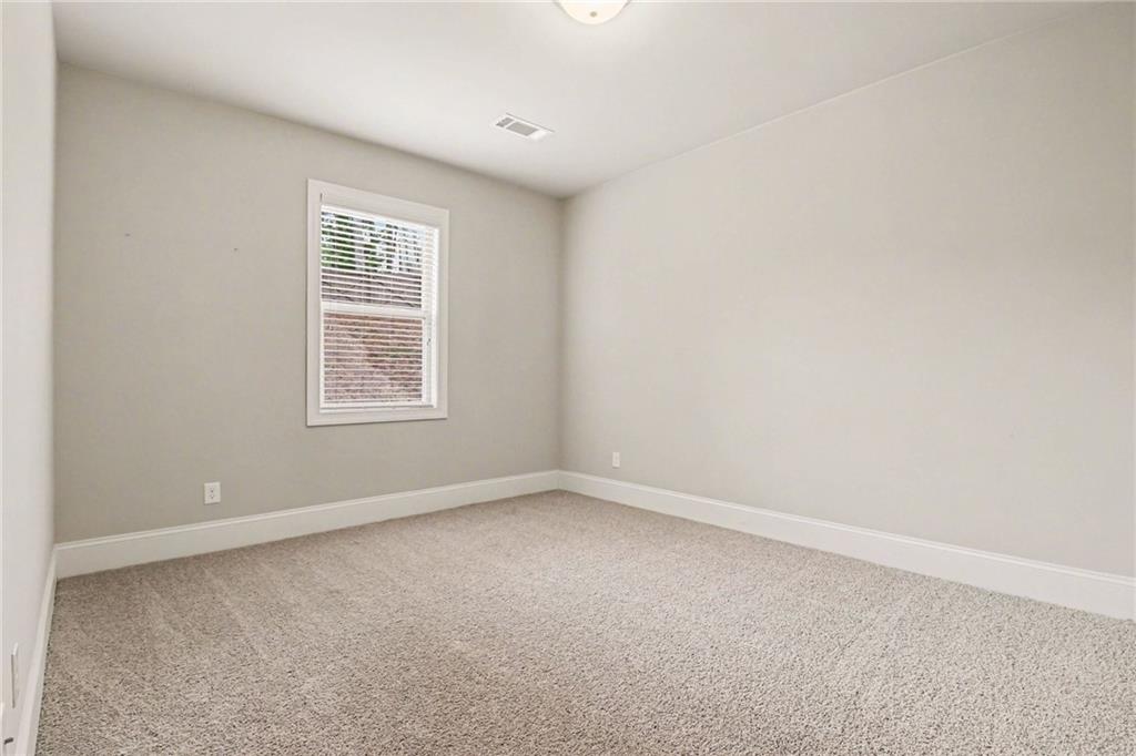 2960 Hampton Grv Trace Dacula, GA 30019 - Photo 18 of 33 an empty room with a window
