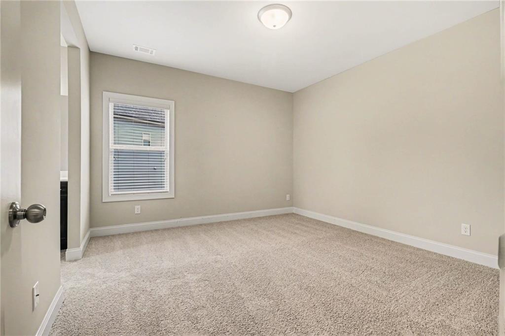2960 Hampton Grv Trace Dacula, GA 30019 - Photo 20 of 33 a view of an empty room with a window