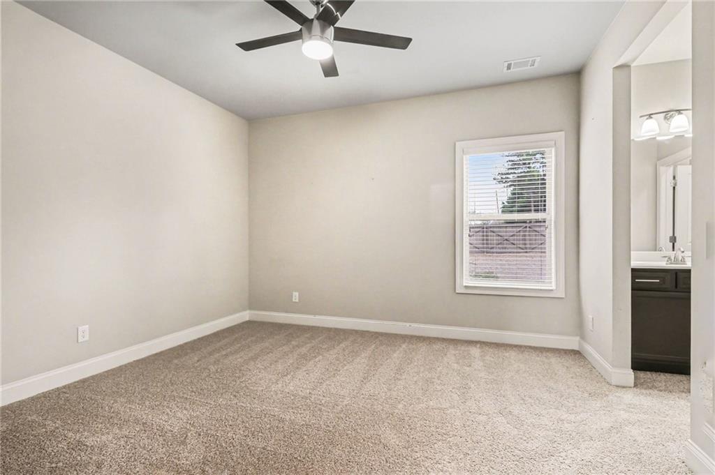 2960 Hampton Grv Trace Dacula, GA 30019 - Photo 21 of 33 an empty room with windows