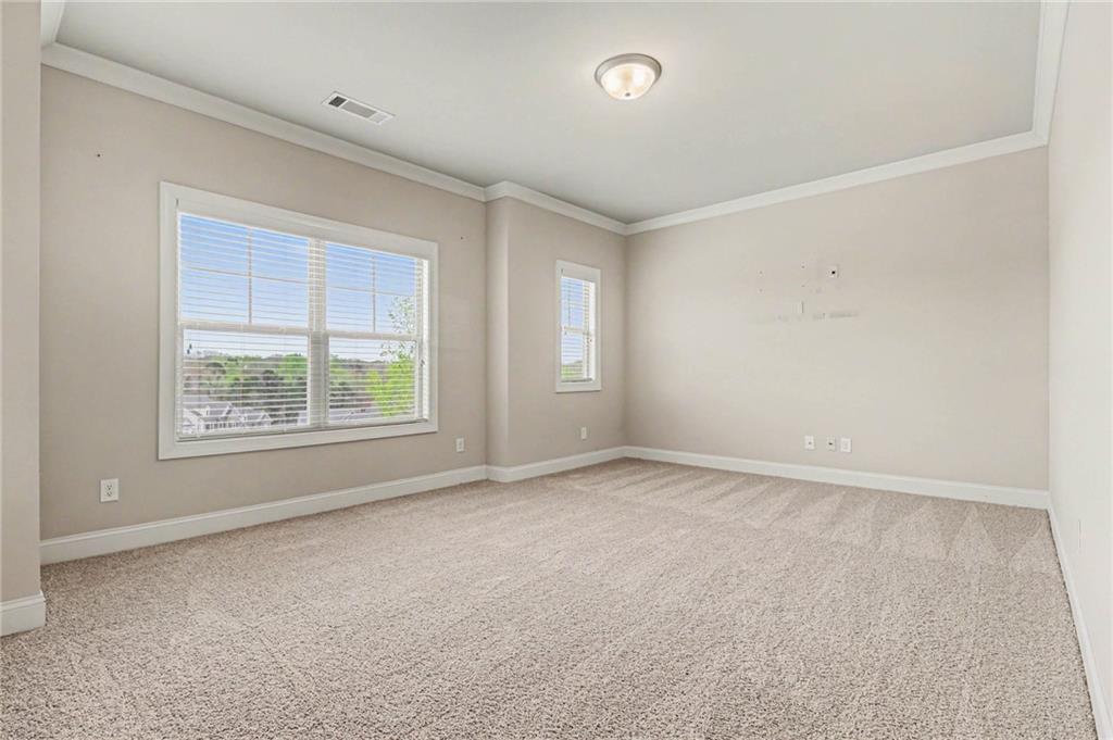 2960 Hampton Grv Trace Dacula, GA 30019 - Photo 24 of 33 an empty room with windows
