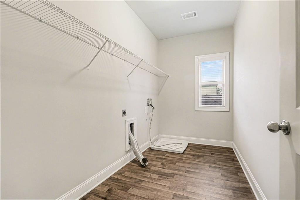 2960 Hampton Grv Trace Dacula, GA 30019 - Photo 25 of 33 a view of small space with wooden floor and white walls
