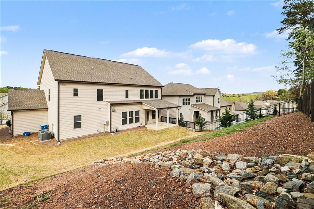 2960 Hampton Grv Trace Dacula, GA 30019 - Photo 33 of 33 a front view of a house with a yard