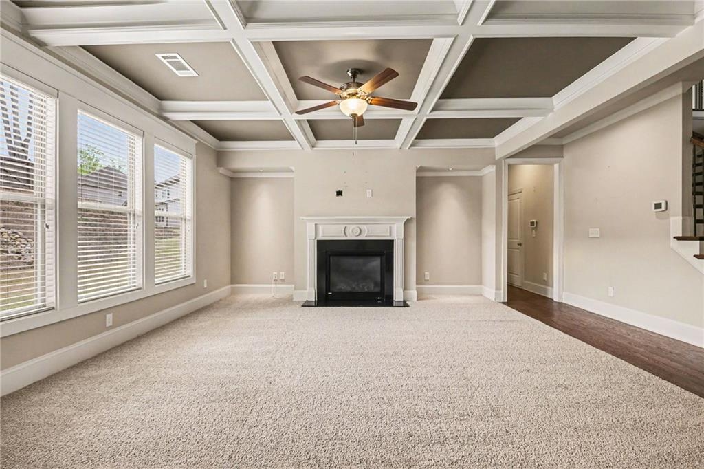 2960 Hampton Grv Trace Dacula, GA 30019 - Photo 5 of 33 a view of an empty room with a fireplace and a window