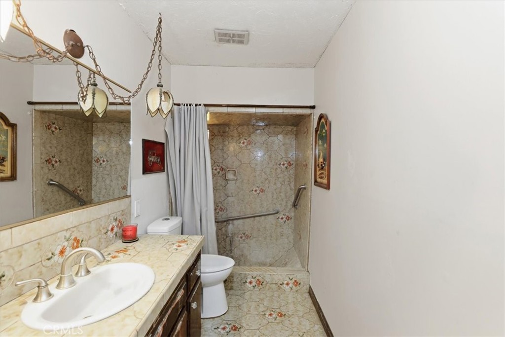 17394 Sunset View Drive Riverside, CA 92504 - Photo 25 of 62 Bathroom attached to bedroom downstairs