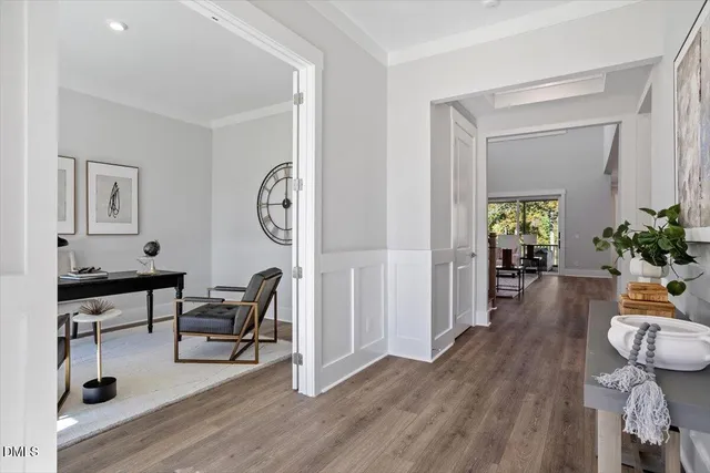 a view of a livingroom with furniture and a potted plant