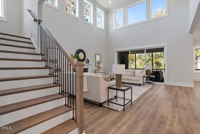 a living room with furniture a fireplace and window