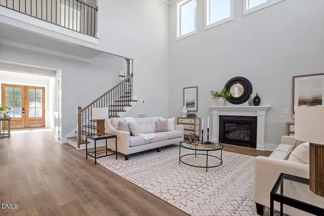 a living room with furniture and kitchen view