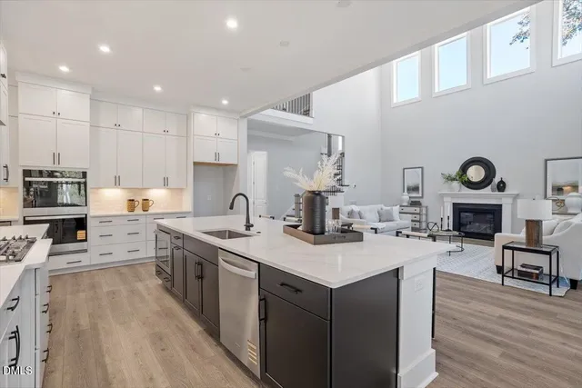 a kitchen with a sink and cabinets