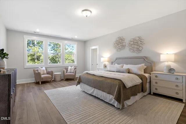a bathroom with a shower sink and mirror