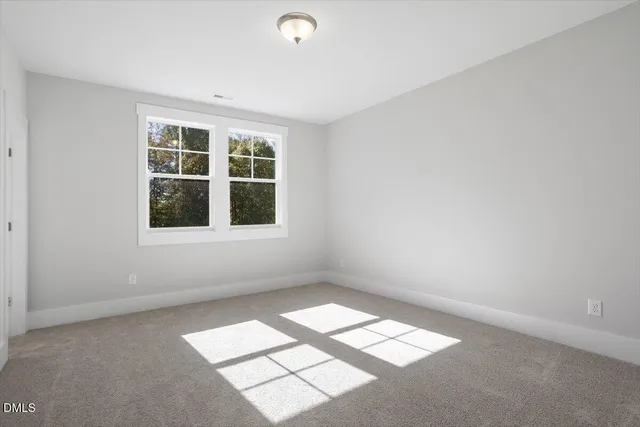 a kitchen with stainless steel appliances granite countertop a stove top oven a sink dishwasher and white cabinets with wooden floor