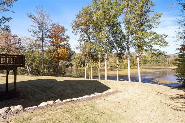 a view of empty room with wooden fence