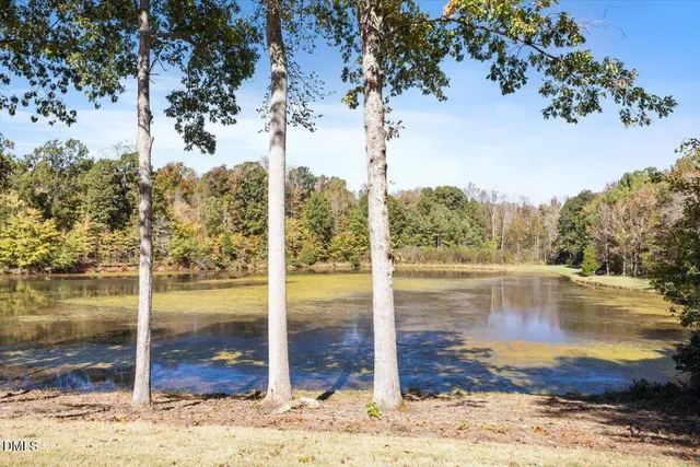 a view of a house with snow on the road