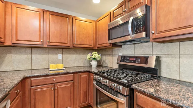 a kitchen with a stove and a microwave