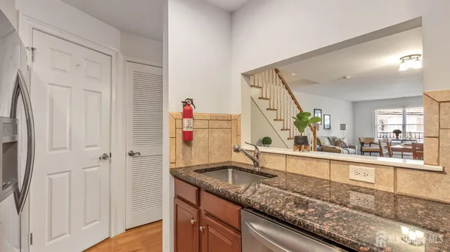 a view of a kitchen from a hallway