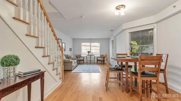 a view of a livingroom with furniture window and wooden floor