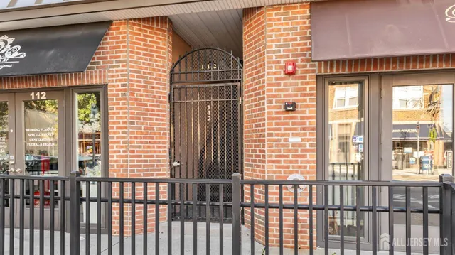 a view of a balcony with wooden floor