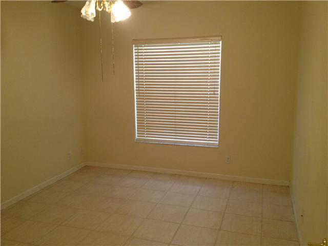 1045 Aspri Way Riviera Beach, FL 33418 - Photo 10 of 19 a view of an empty room with a window