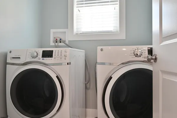 a utility room with dryer and washer