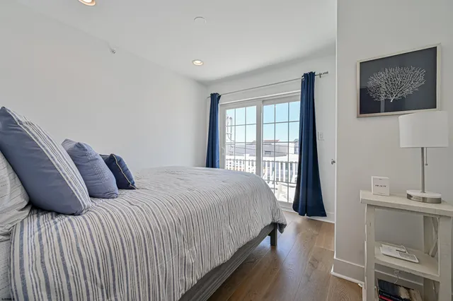 a bedroom with a bed and a table