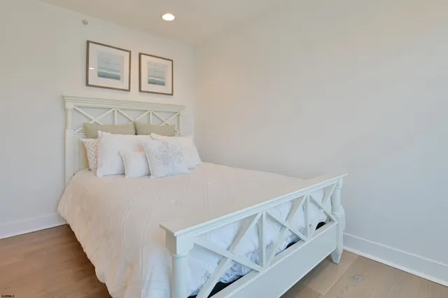 a bedroom with a bed and white walls