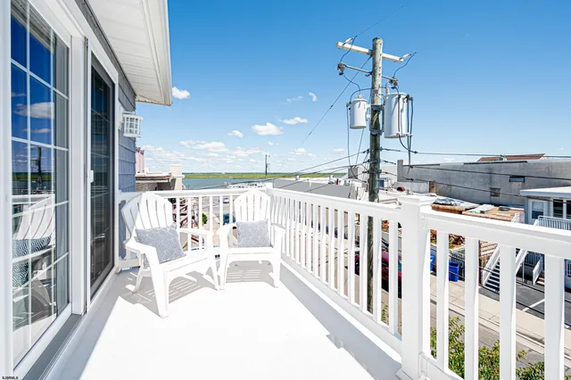 a view of a balcony with chairs