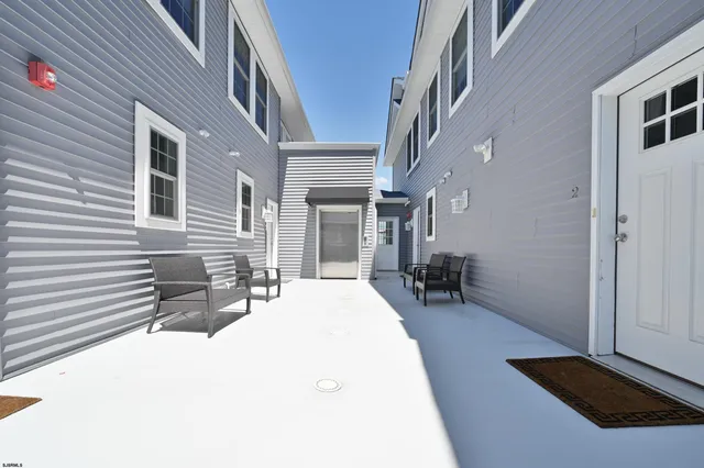 a backyard of a house with seating space