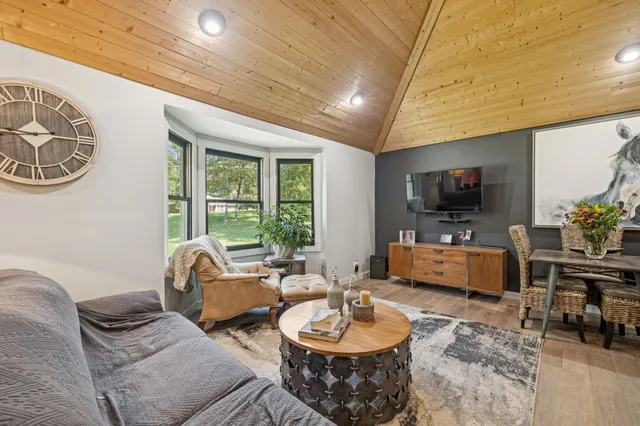 a living room with furniture and a table