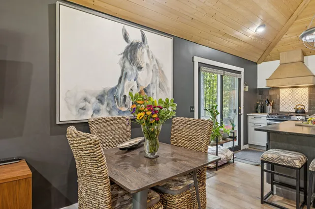 a kitchen with stainless steel appliances a stove a sink and a refrigerator