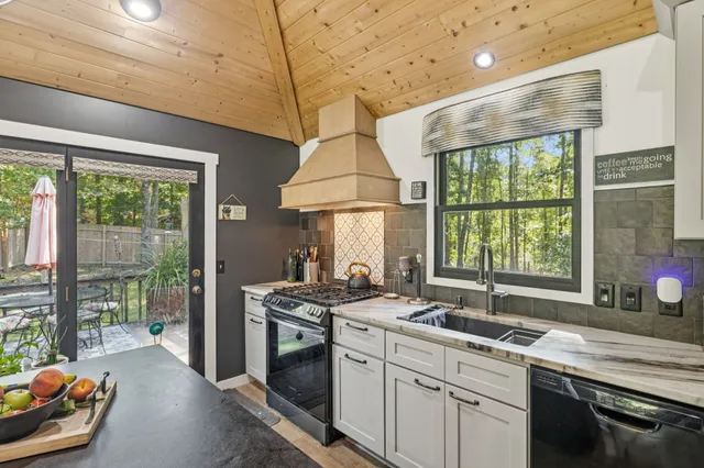 a view of a dining room with furniture wooden floor and chandelier