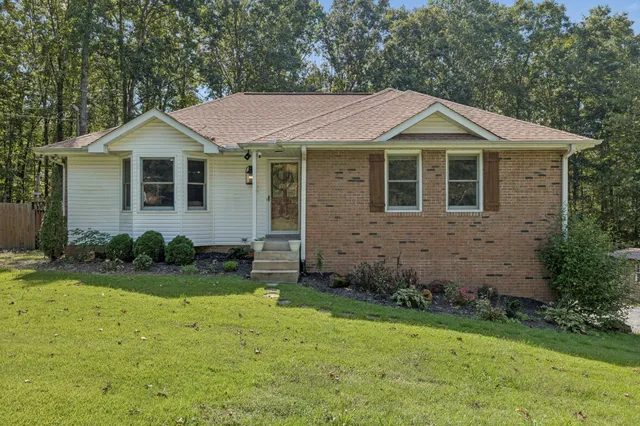 a front view of a house with garden