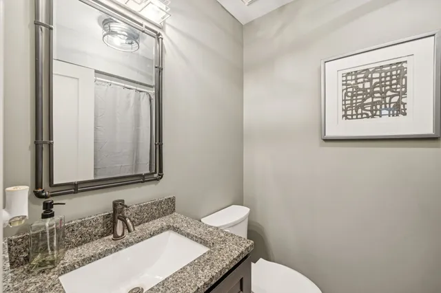 a view of a livingroom with workspace and a window