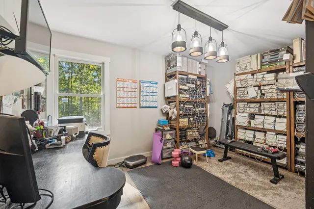 a view of a livingroom with furniture and a flat screen tv