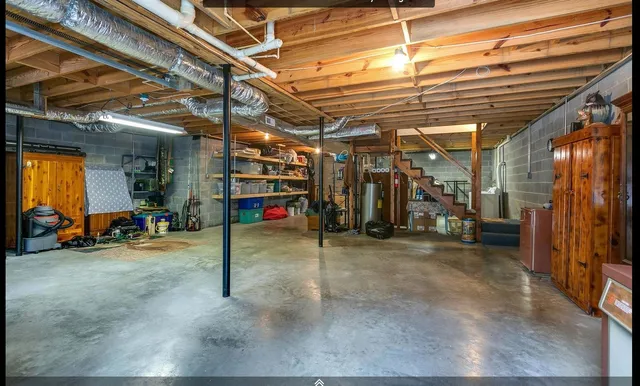 a view of a small house with a yard