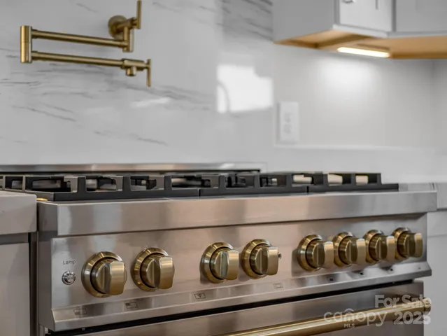 a bathroom with a bathtub and next to a window