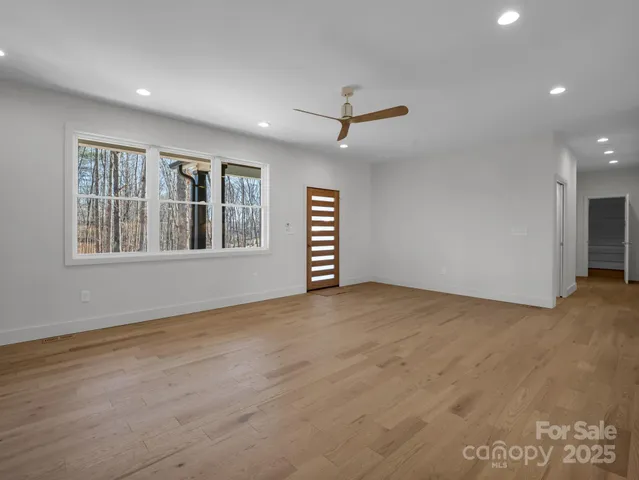 a view of a kitchen with a stove cabinets and wooden floor