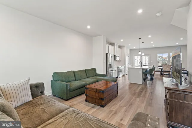 a bedroom with a bed a book shelf and a window