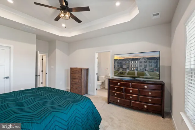 a bedroom with a bed and a dresser