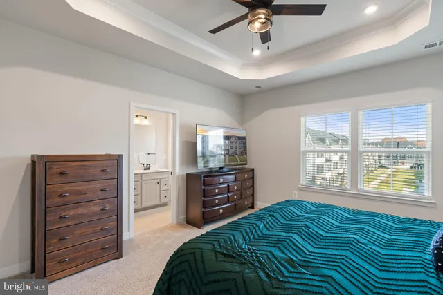 a bathroom with a sink vanity and toilet