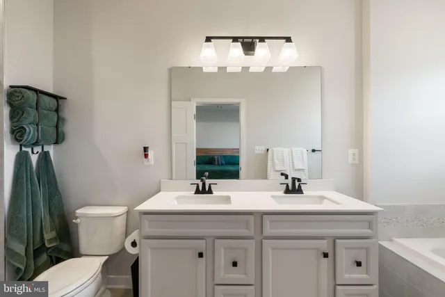 a bathroom with a bathtub and window