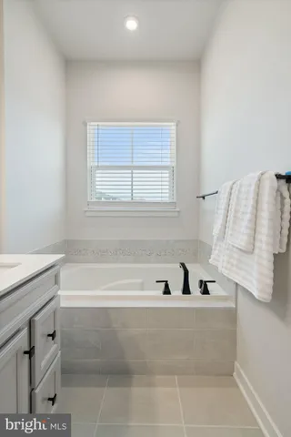 a bathroom with a shower a toilet and a window